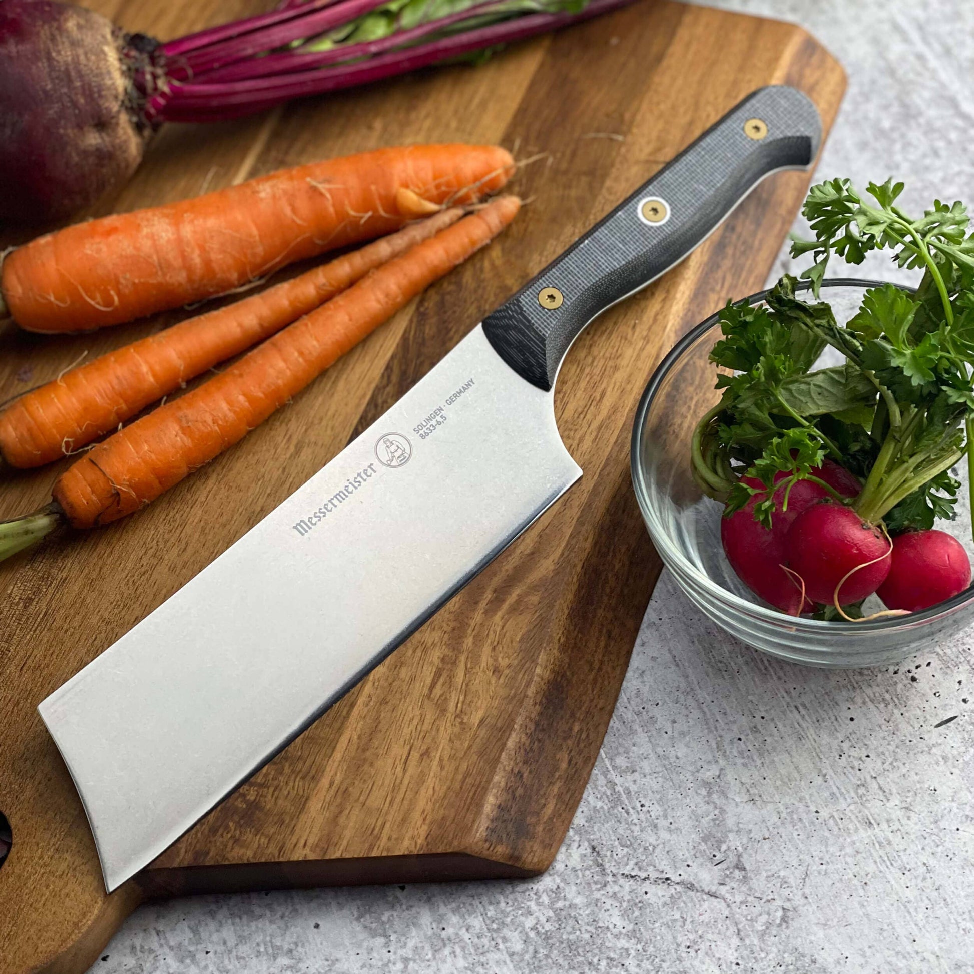 The Nakiri knife has a straight, Asian-style edge. 