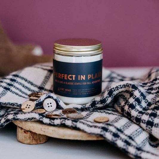 Fill your home with a cozy fall scent when you buy this Perfect in Plaid candle. 
