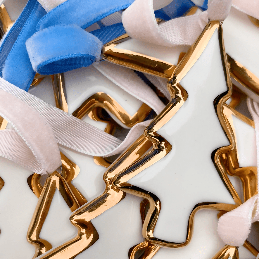 Buy 1 (one) porcelain Christmas tree ornament. 