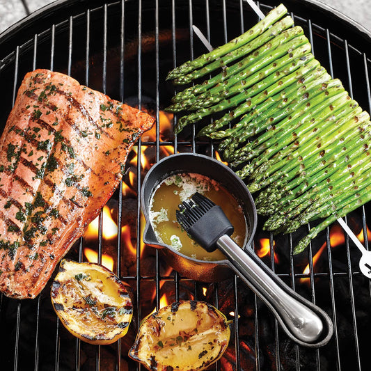 The cast iron sauce pot is heat-safe, so you can use it to melt butter on the grill. 