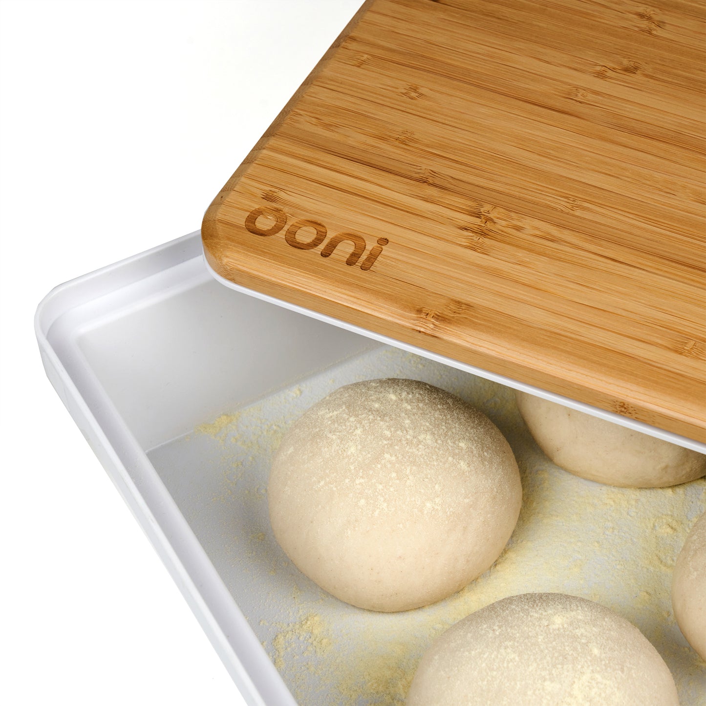 The Ooni prep lid, pictured here, sits on top of your dough box to shape your pizza. The dough boxes are sold separately.