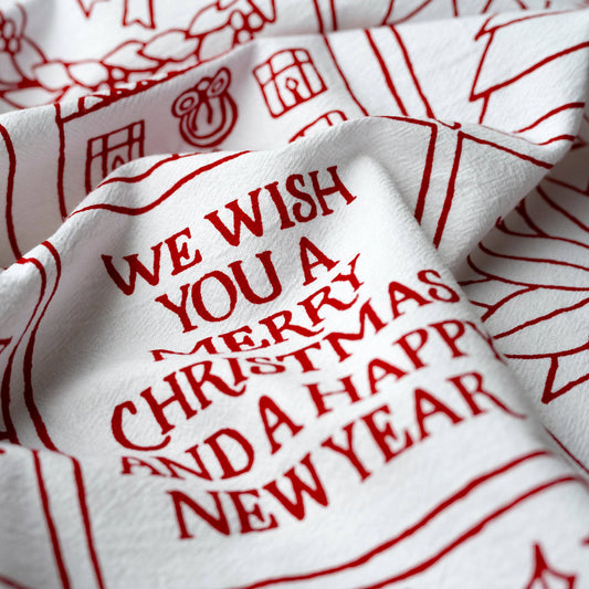 Beautiful red print on a white cotton towel will give your kitchen a festive holiday feel. 
