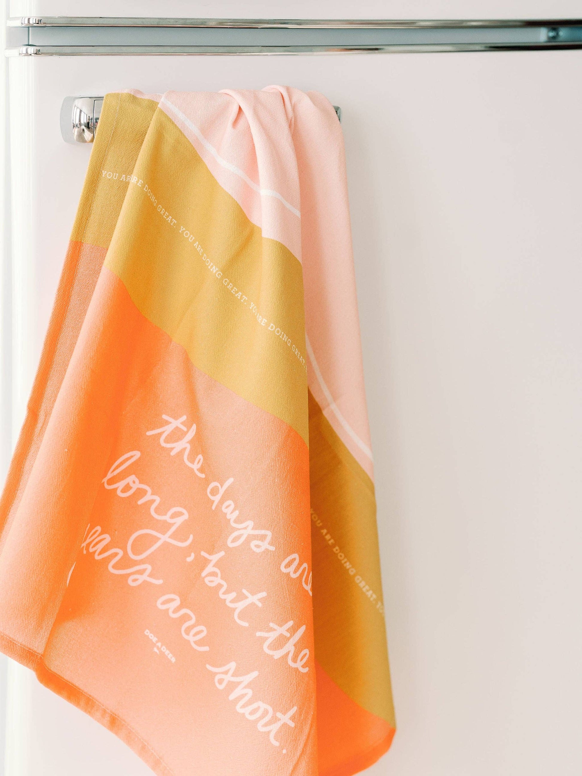 The tea towel comes with a hanging loop so it's always easy to reach in the kitchen. 