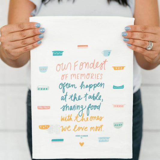Buy one (1) tea towel that reads, "Our fondest of memories often happen at the table, sharing food with the ones we love most."