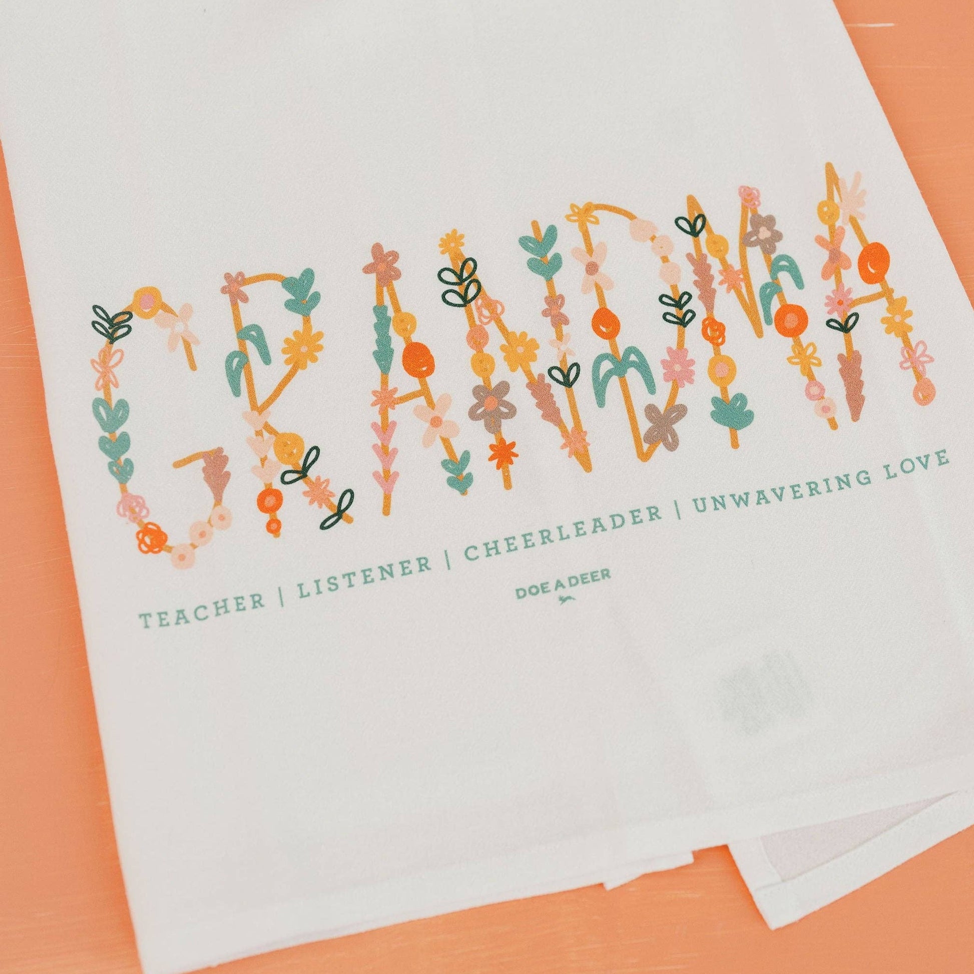 The colorful Grandma print on a white cotton towel looks great in every kitchen. 