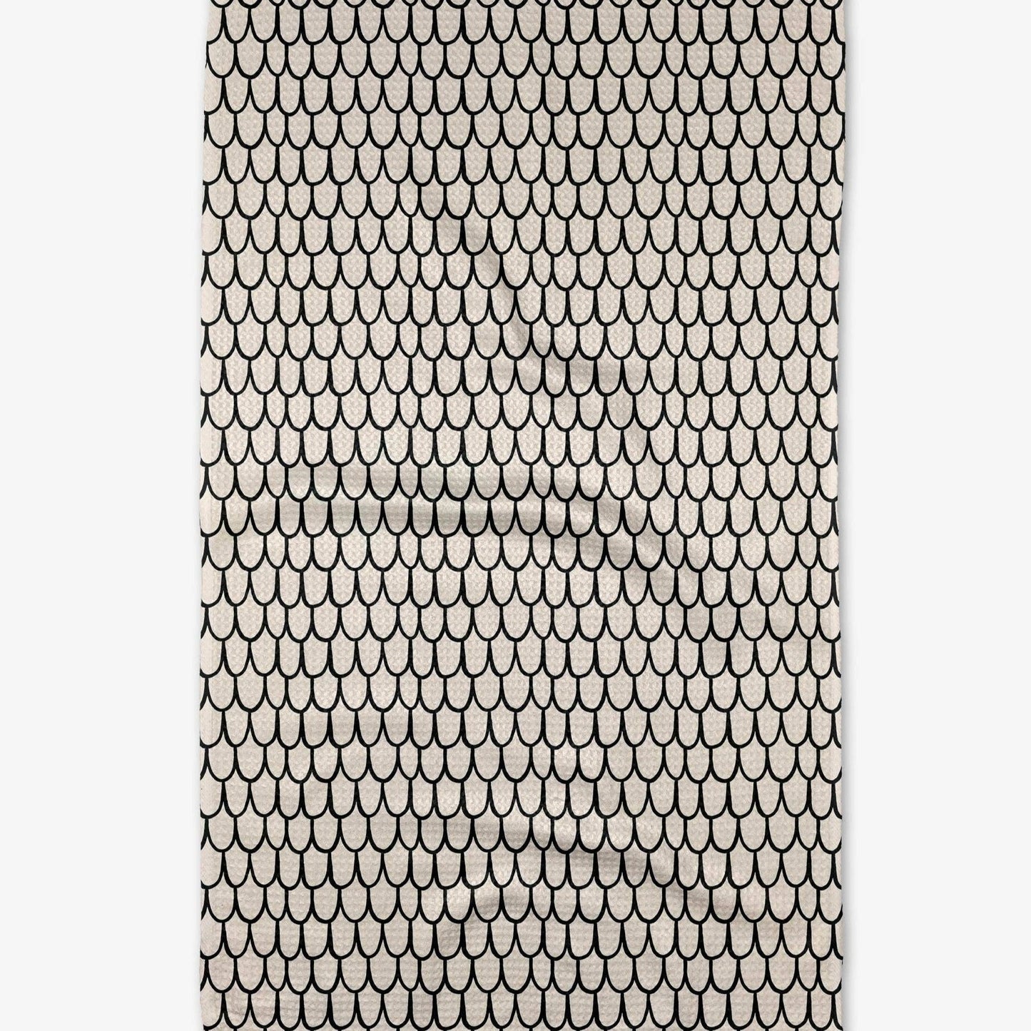 Buy one (1) cream colored tea towel with a repeating fish scale pattern.