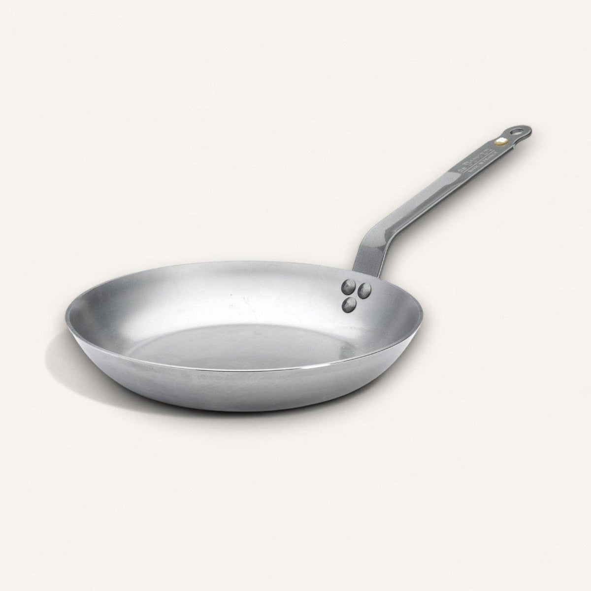 The classic de Buyer MINERAL B skillet on a white background