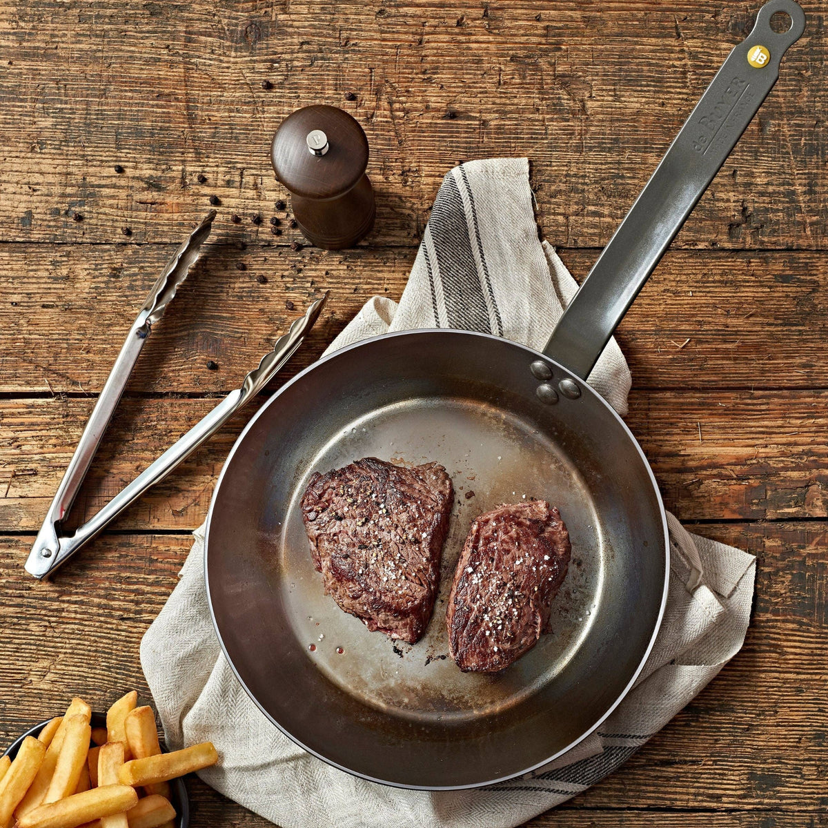 Perfectly seared steaks are ready to serve in a de Buyer MINERAL skillet. 