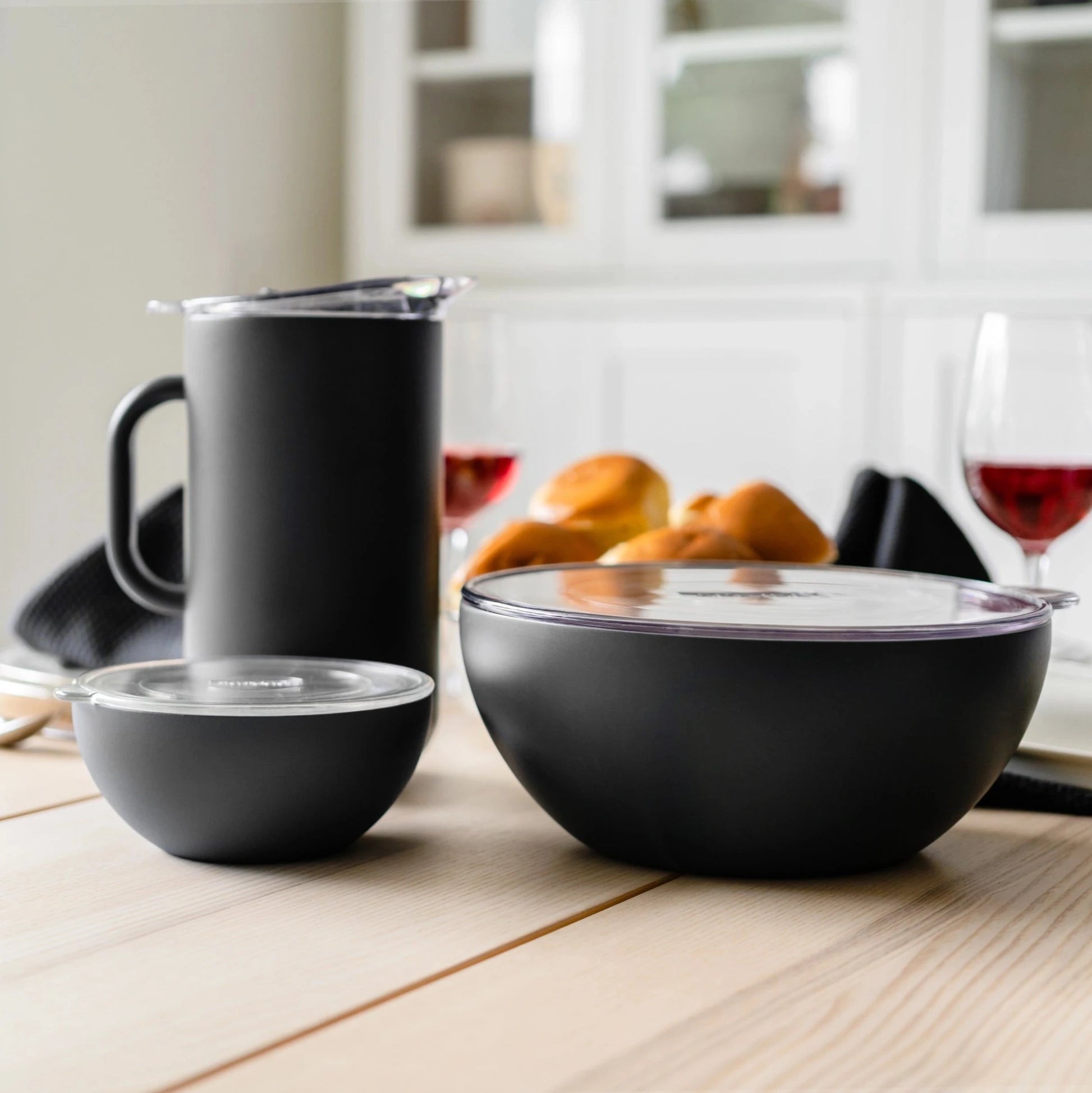 Buy one (1) black insulated pitcher, which can be part of a set of insulated servewear.